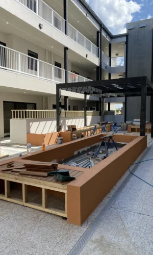 Painting team applying low-VOC coat to a modern Adelaide CBD office interior