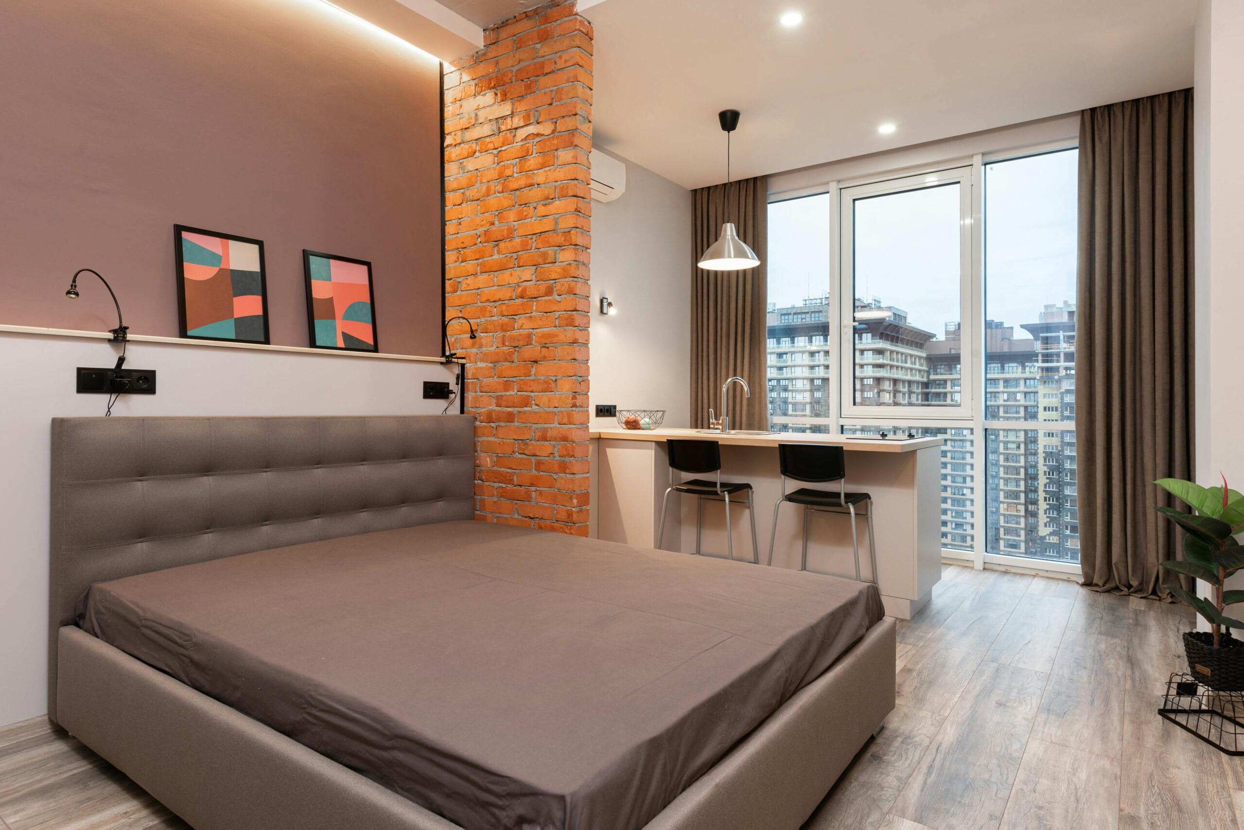 Stylish apartment interior featuring a modern design with an urban cityscape view.